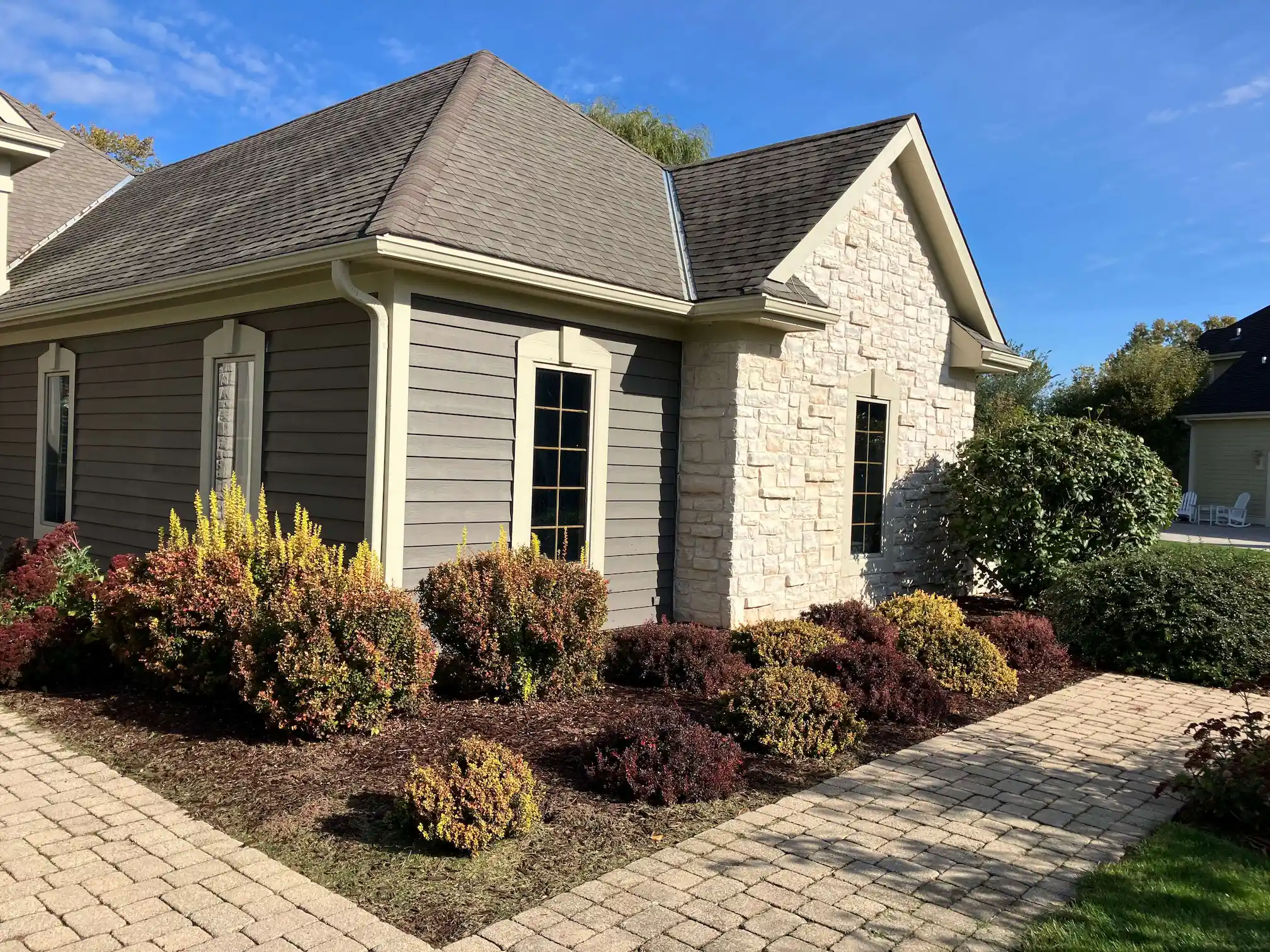 Freshly painted exterior home with cedar siding.